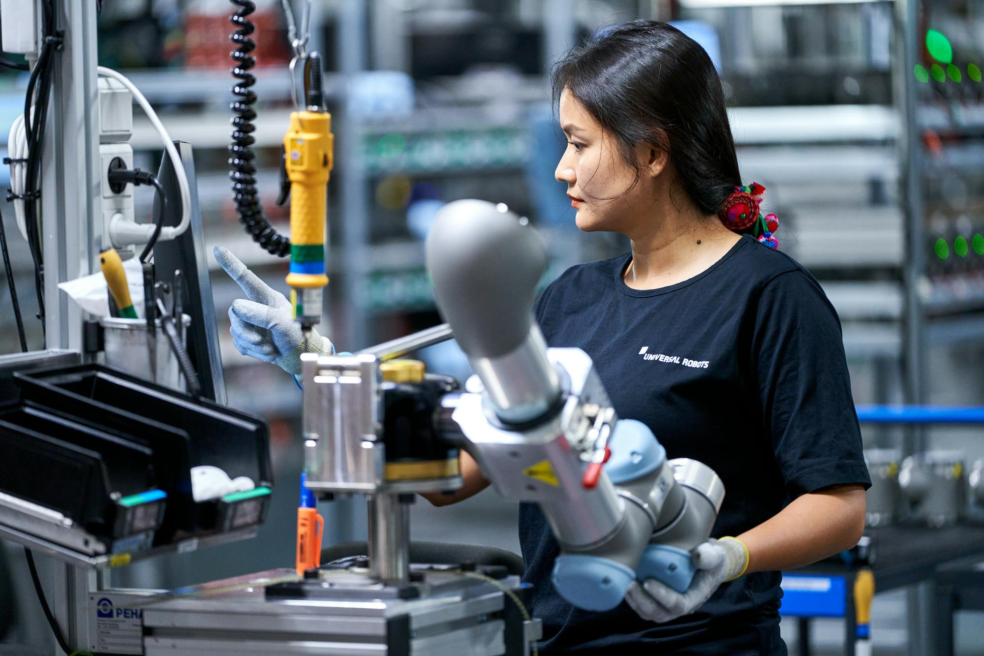 A female worker on Universal Robots' production line at the company's global HQ in Odense, Denmark.