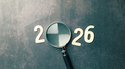 Magnifying glass forms the zero in 2026, looking ahead. Magnifying glass forms the zero in 2026, looking ahead.