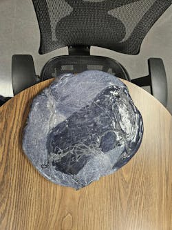 The size of this slab of plastic, produced when a technician tried to clean out an injection molding machine at Tech-Way by simply letting the machine run, shows how much material and time are wasted when purging compound isn't used as part of a material or color changeover. The size of this slab of plastic, produced when a technician tried to clean out an injection molding machine at Tech-Way by simply letting the machine run, shows how much material and time are wasted when purging compound isn't used as part of a material or color changeover.