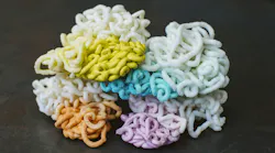 Shuman Plastics used E4 to purge an injection molding machine of colored plastics, producing these piles of plastics, chronicling the process from the beginning, starting with a colorant and ending when that colorant was completely drained from the system.