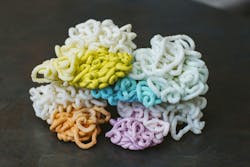 Shuman Plastics used E4 to purge an injection molding machine of colored plastics, producing these piles of plastics, chronicling the process from the beginning, starting with a colorant and ending when that colorant was completely drained from the system. Shuman Plastics used E4 to purge an injection molding machine of colored plastics, producing these piles of plastics, chronicling the process from the beginning, starting with a colorant and ending when that colorant was completely drained from the system.