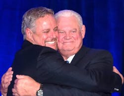 Mark Strachan hugs his father, Ian Strachan, at an event in 2016 honoring the older man as the Thermoformer of the Year for the Thermoforming Division of the Society of Plastics Engineers. Mark Strachan hugs his father, Ian Strachan, at an event in 2016 honoring the older man as the Thermoformer of the Year for the Thermoforming Division of the Society of Plastics Engineers.