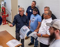 Mark Strachan, far left, is passionate about sharing his knowledge about plastics processing with others in the industry. Mark Strachan, far left, is passionate about sharing his knowledge about plastics processing with others in the industry.