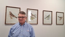 Glenn Frohring, co-owner of Absolute Haitian, with bird pictures in the company's offices in Parma, Ohio. Glenn Frohring, co-owner of Absolute Haitian, with bird pictures in the company's offices in Parma, Ohio.