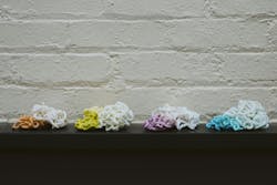 Shuman Plastics used E4 to purge an injection molding machine of colored plastics, producing these piles of plastics, chronicling the process from the beginning, starting with a colorant and ending when that colorant was completely drained from the system. Shuman Plastics used E4 to purge an injection molding machine of colored plastics, producing these piles of plastics, chronicling the process from the beginning, starting with a colorant and ending when that colorant was completely drained from the system.