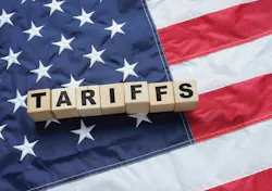 An American flag overlaid with the word 'tariffs.' An American flag overlaid with the word 'tariffs.'