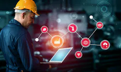 A manufacturing employee works with a computer to control processes A manufacturing employee works with a computer to control processes