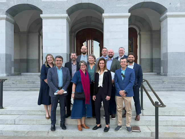Fly-In participants stand on the steps of the California State Capitol.