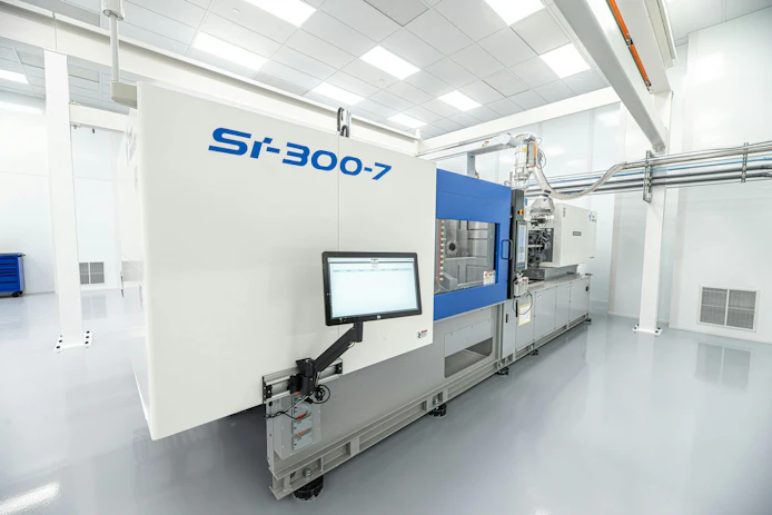 The centerpiece of Rosti's new clean room in Germantown, Wis., is a 300-ton injection Toyo Si-7 molding machine.