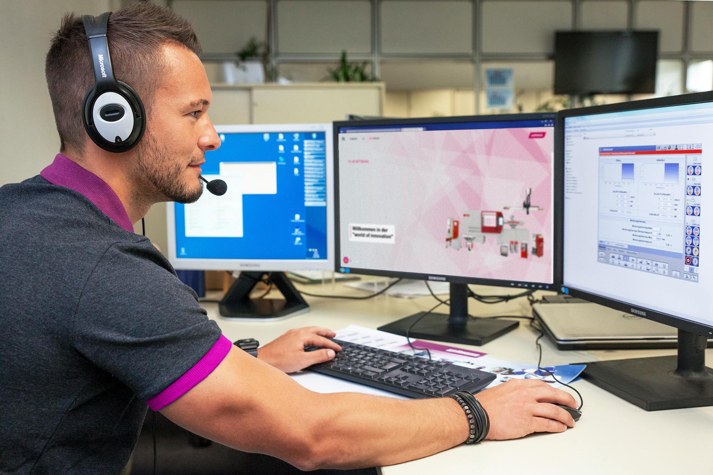 A Wittmann technician looks over data about machine health. New artificial intelligence (AI)-powered tools put control at the tip of operators' fingerprints, reducing the possibility of unplanned downtime.