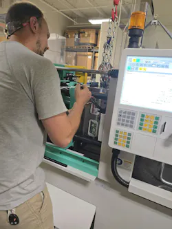 A mold is mounted to an injection molding machine at Ferris State. A mold is mounted to an injection molding machine at Ferris State.