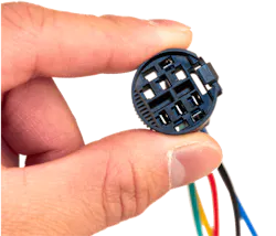 This momentary switch connector was printed in bulk using the Figure 4 3D printer and Figure 4 Tough FR V0 material. This momentary switch connector was printed in bulk using the Figure 4 3D printer and Figure 4 Tough FR V0 material.