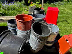 A pile of plastic greenhouse pots. A pile of plastic greenhouse pots.