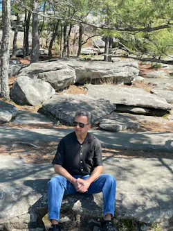 Mahesh Gupta takes a break from a hike at Stone Mountain, Georgia.