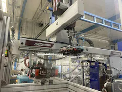 A linear three-axis Wittmann W808 robot works alongside a SmartPower press at Phoenix campus of golf equpiment maker Ping.