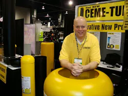 Blow molder and inventor Jim Bradac with the Ceme-Tube, a plastic form for cement bases of light poles.