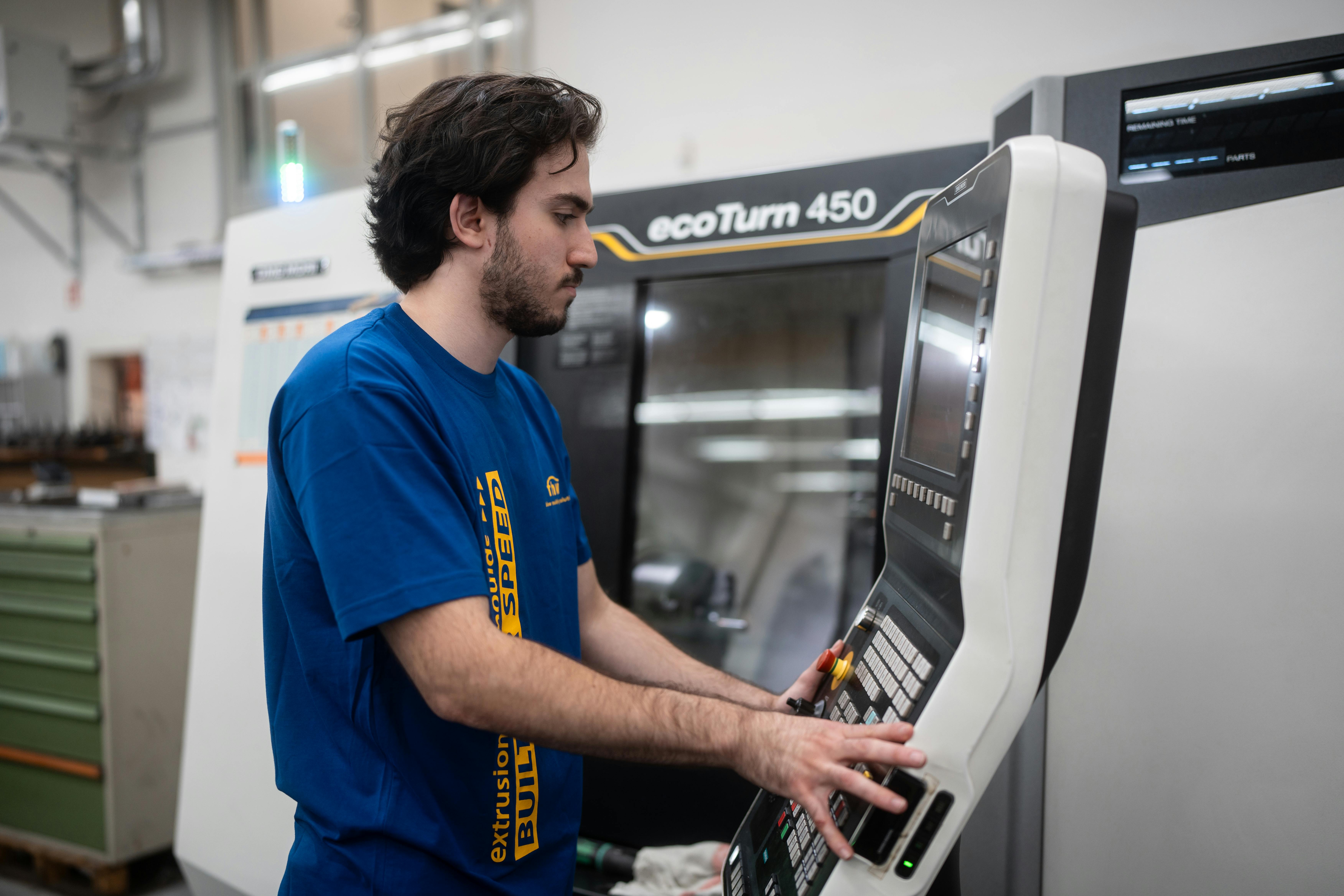A worker operates a machine at fhw-moulds GmbH in Bottrop, Germany.