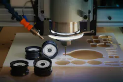 Parts are cut from a sheet of white plastic.