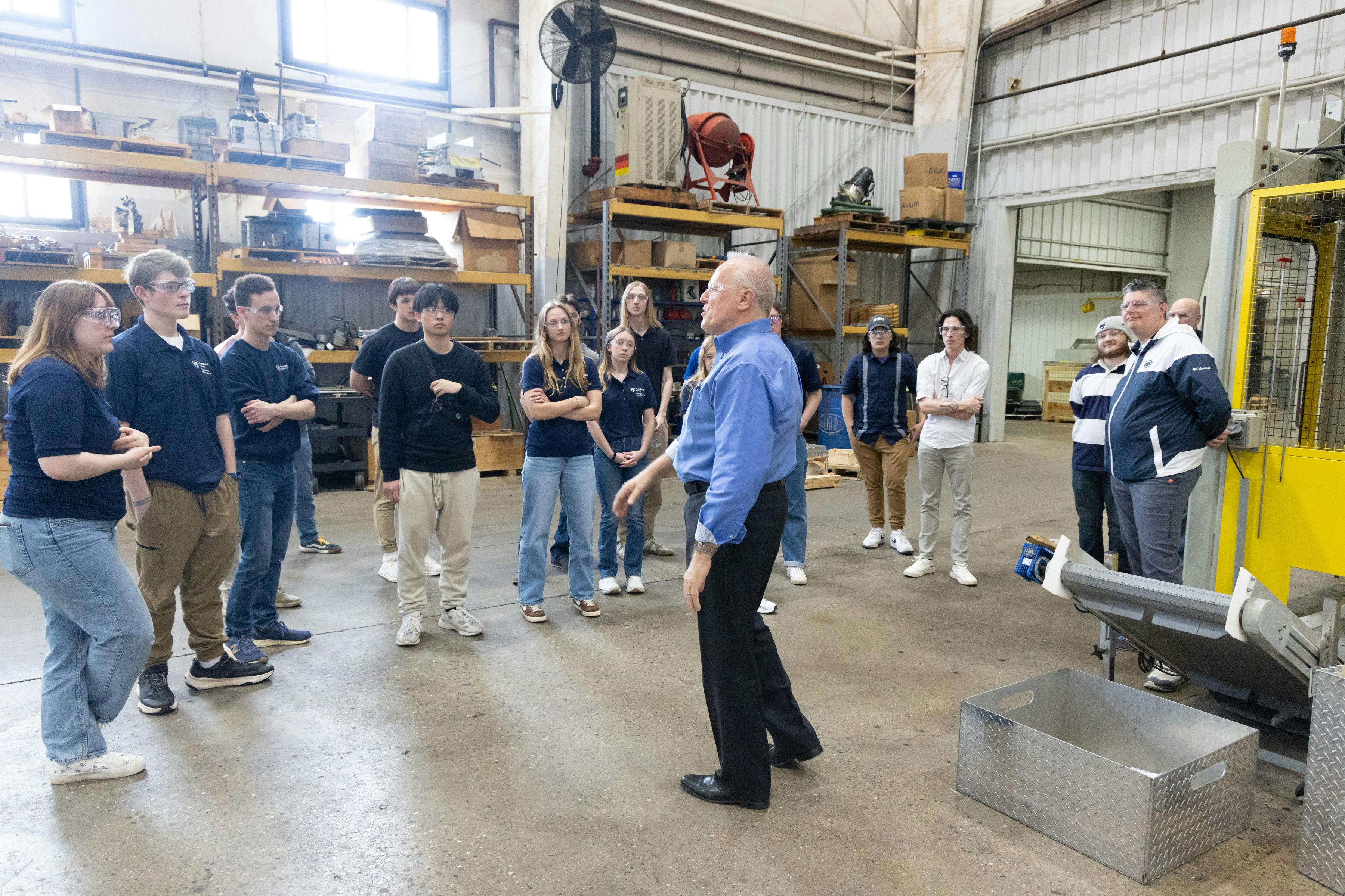 Bekum America&rsquo;s VP of sales, Gary Carr, gives Penn State Behrend students a tour of the facility.