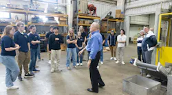 Bekum America’s VP of sales, Gary Carr, gives Penn State Behrend students a tour of the facility.