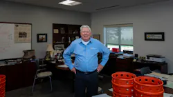 Richard 'Dick' Smith, founder of Agri-Industrial Plastics, in his office