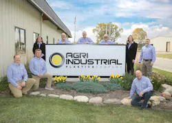 The senior managers of Agri-Industrial Plastics outside the plant in Fairfield, Iowa.