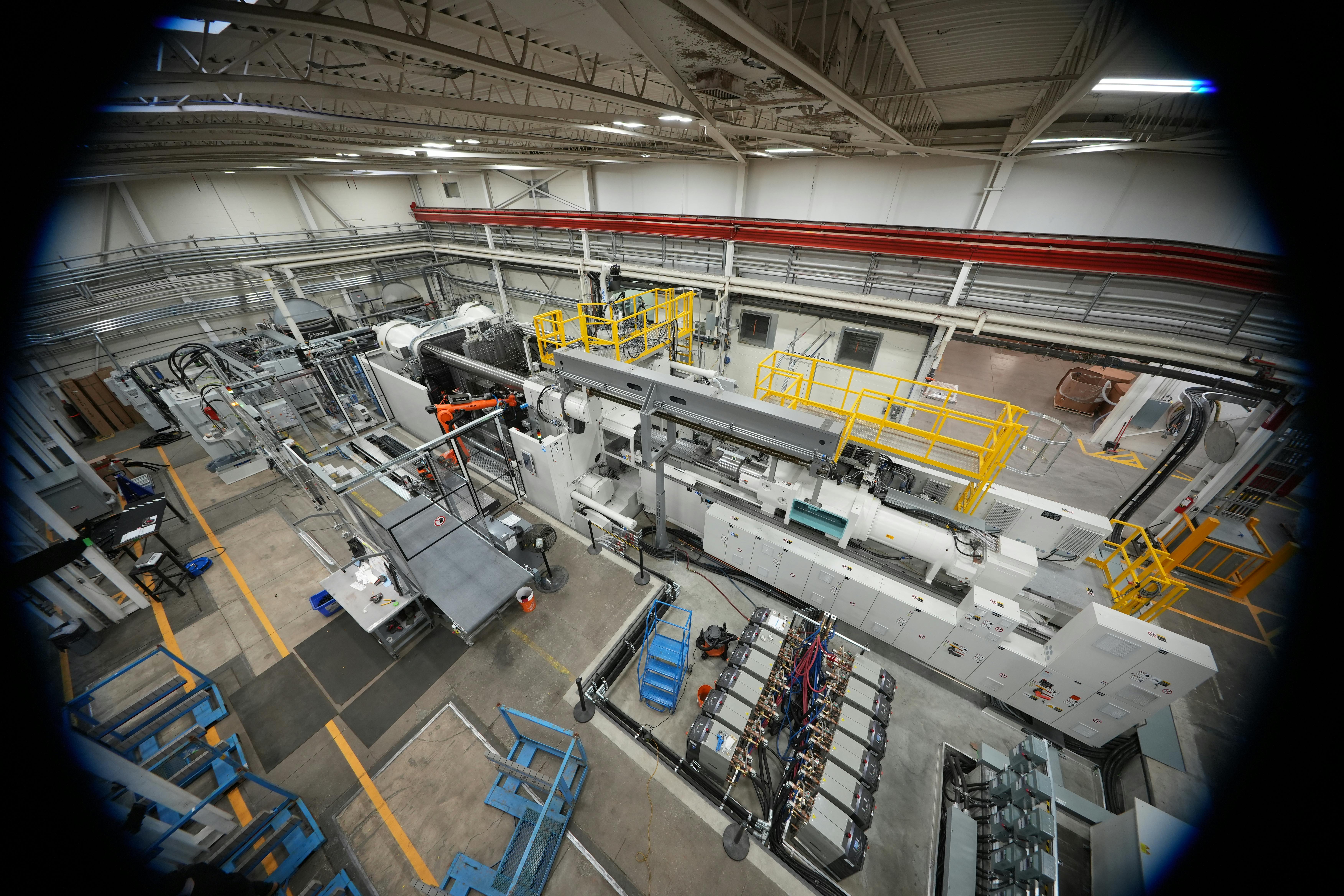 This 4,500-ton KraussMaffei ColorForm injection molding machine makes PUR-coated automotive parts at Omega Tool Corp.