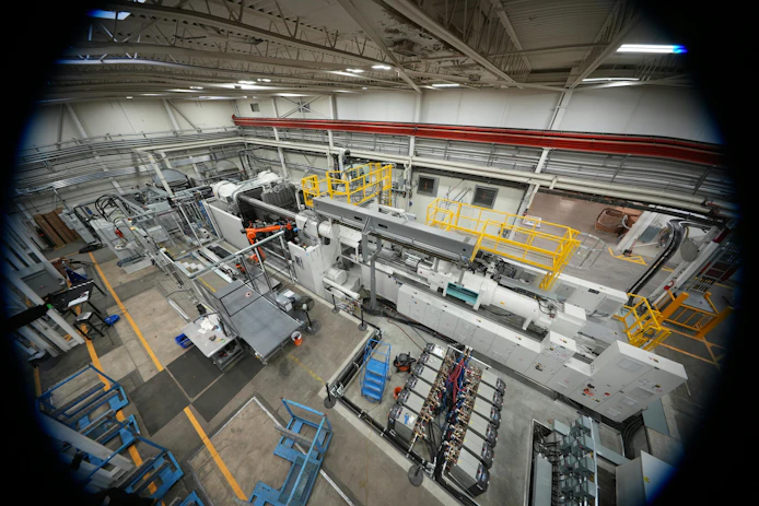 This 4,500-ton KraussMaffei ColorForm injection molding machine makes PUR-coated automotive parts at Omega Tool Corp.