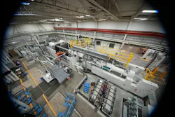 This 4,500-ton KraussMaffei ColorForm injection molding machine makes PUR-coated automotive parts at Omega Tool Corp.