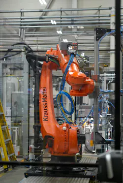 This part demolding robot is part of Omega's ColorForm cell.