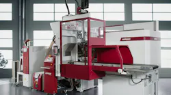 A Wittmann Ingrinder production cell for molding clamps and recycling scrap within the cell.