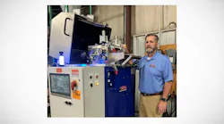 Jason Forgash, CEO of Bay Plastics Machinery, with an AXP08 Strand Pelletizer with the S.M.A.R.T. System controller.