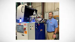 Jason Forgash, CEO of Bay Plastics Machinery, with an AXP08 Strand Pelletizer with the S.M.A.R.T. System controller.
