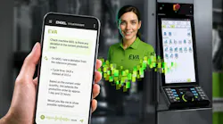 Operator holds smartphone communicating to injection molding machine via EVA digital assistant