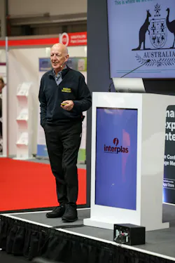 Robin Kent, energy consultant and founder of Tangram Technology, speaks on a stage.