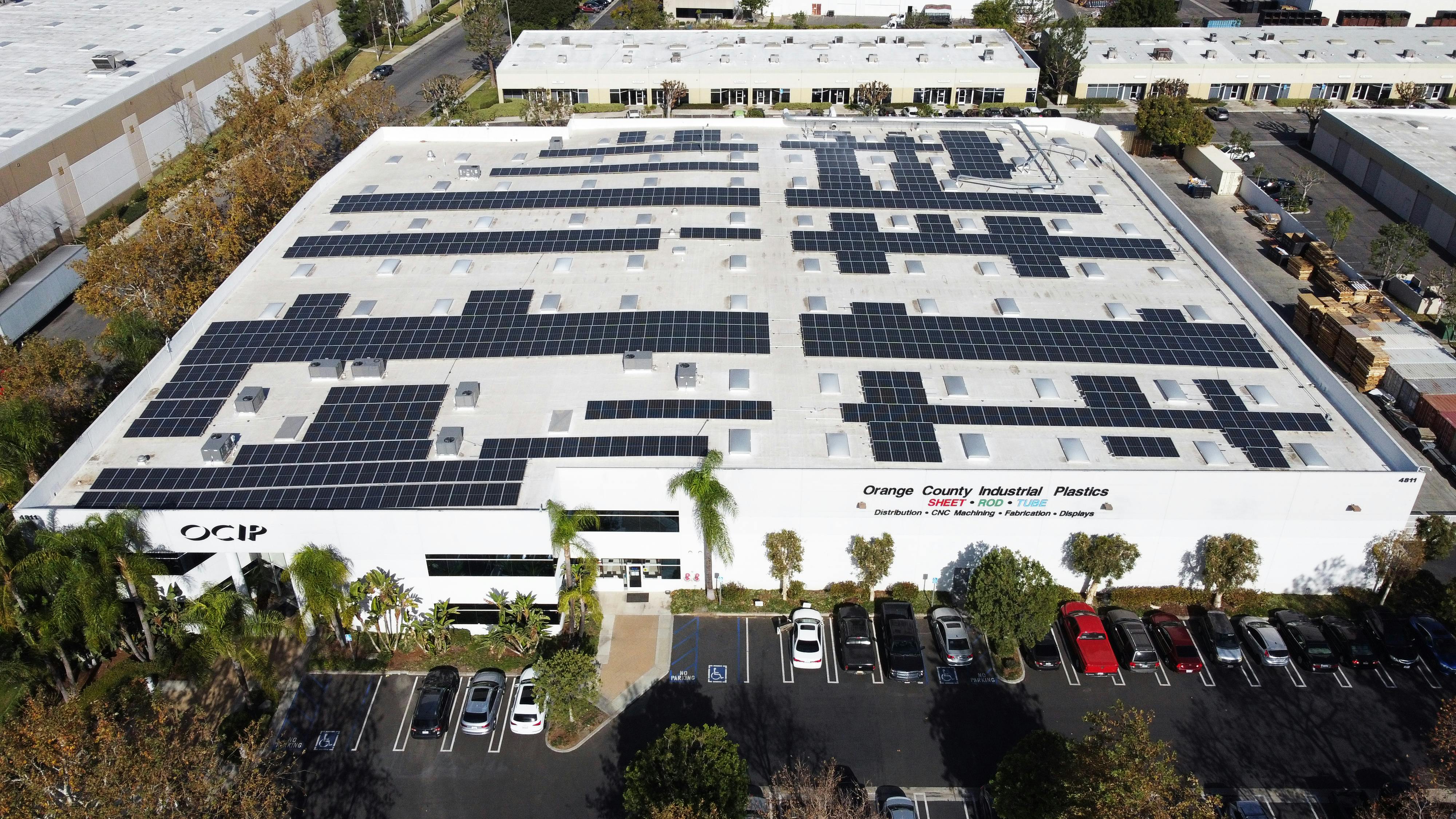 View of the large roof and solar energy system at Orange County Industrial Plastics.