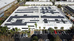 View of the large roof and solar energy system at Orange County Industrial Plastics.