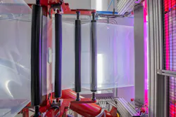 A film extrusion line at Peak Nano is viewed from below.