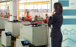 Photo illustration shows a female executive pensively looking at a plastics production floor.