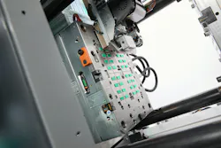 A multi-component Allrounder More 2000 with a 32-cavity mold from Polarform and Hasco will be producing 32 two-colored dominoes from ABS.