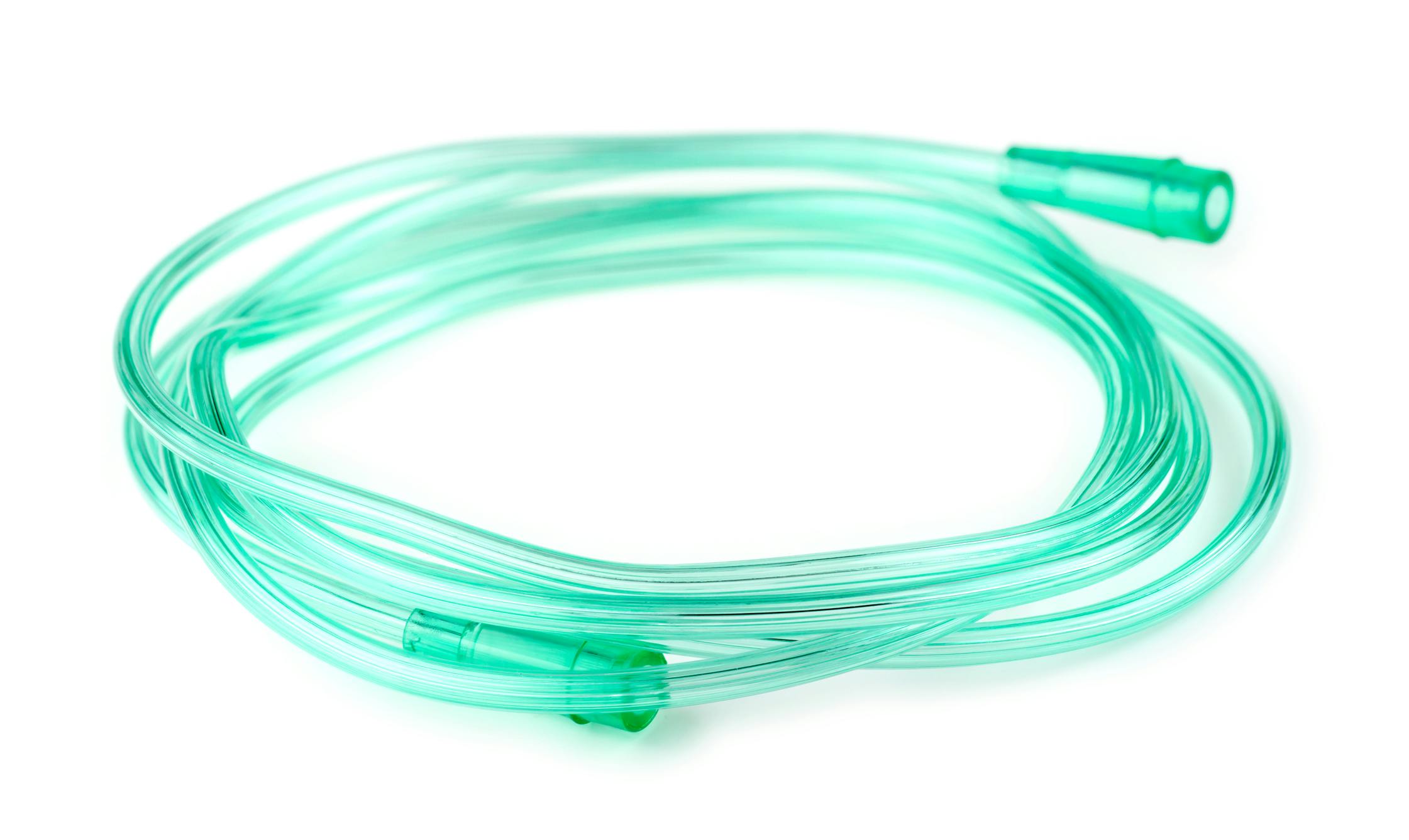 Green medical tubing against a white background