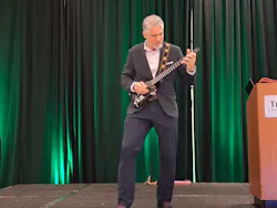 Motivational speaker and mountain climber Manley Feinberg spiced up his presentation with some guitar shredding.