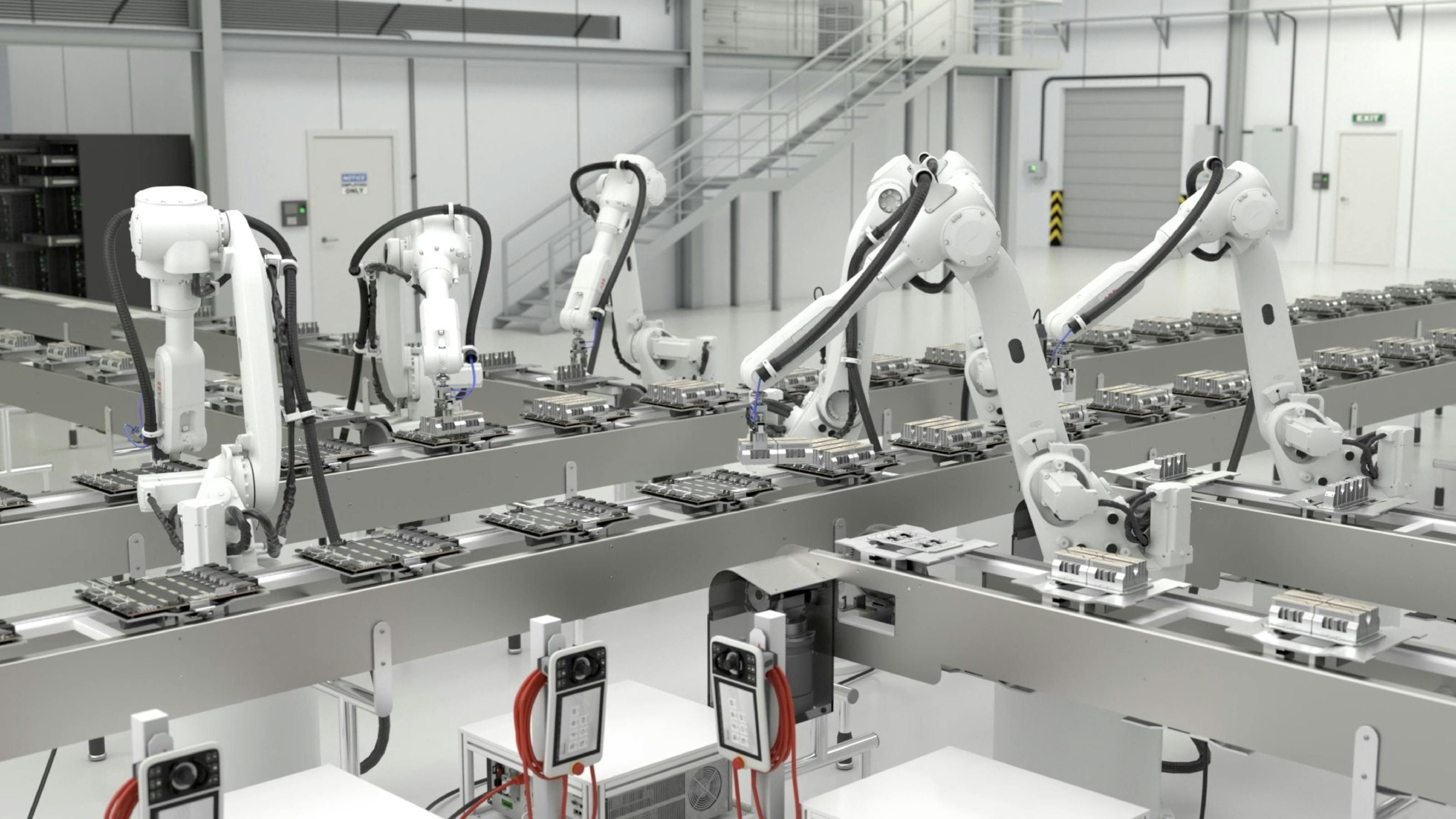 Five white industrial robots work on server components.